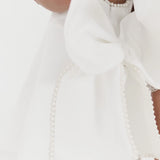 LACE AND LAVANDER PEARL TRIMMED BOW BACK DRESS - WHITE